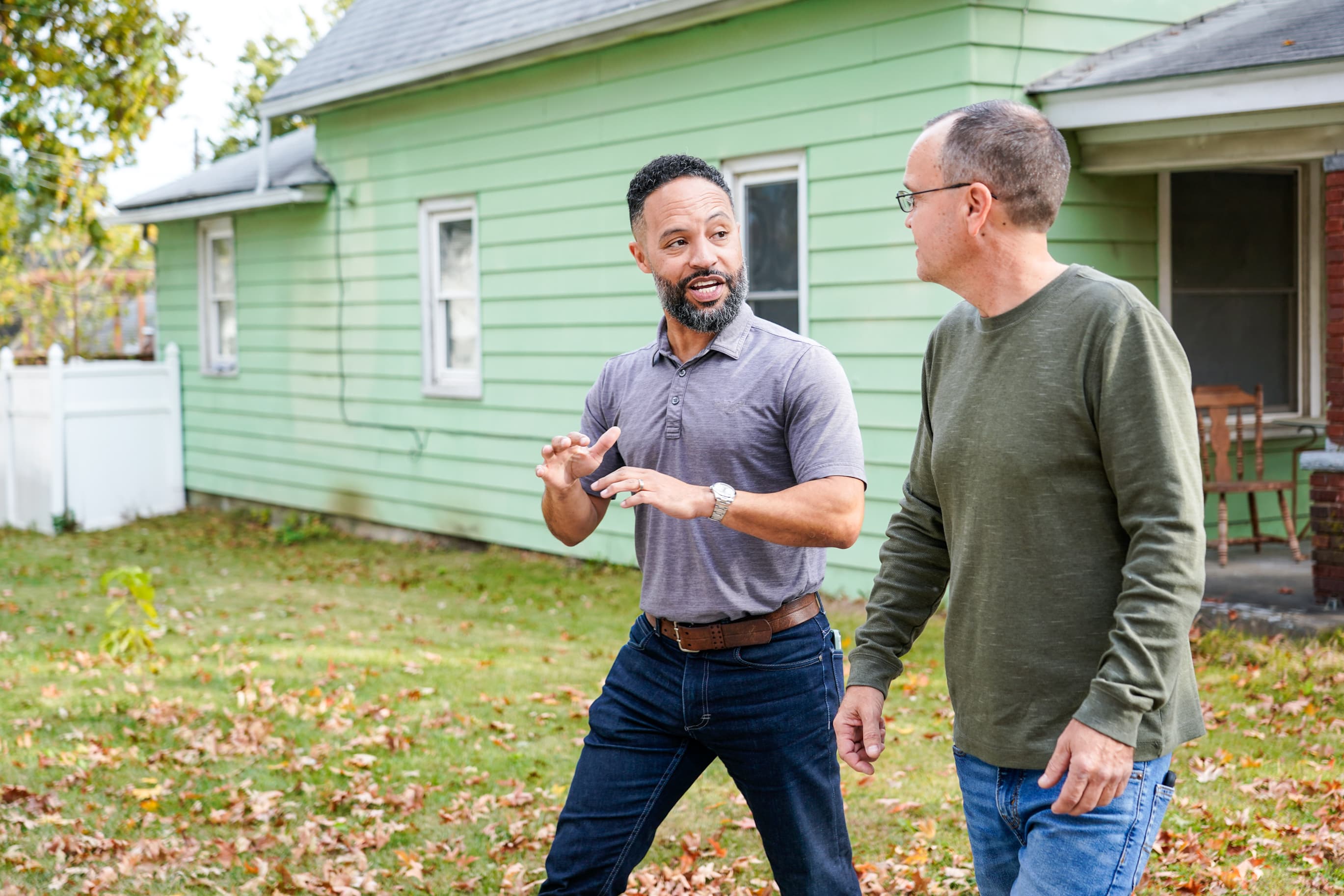 Erik Murray meeting a Kansas neighbor on his front porch